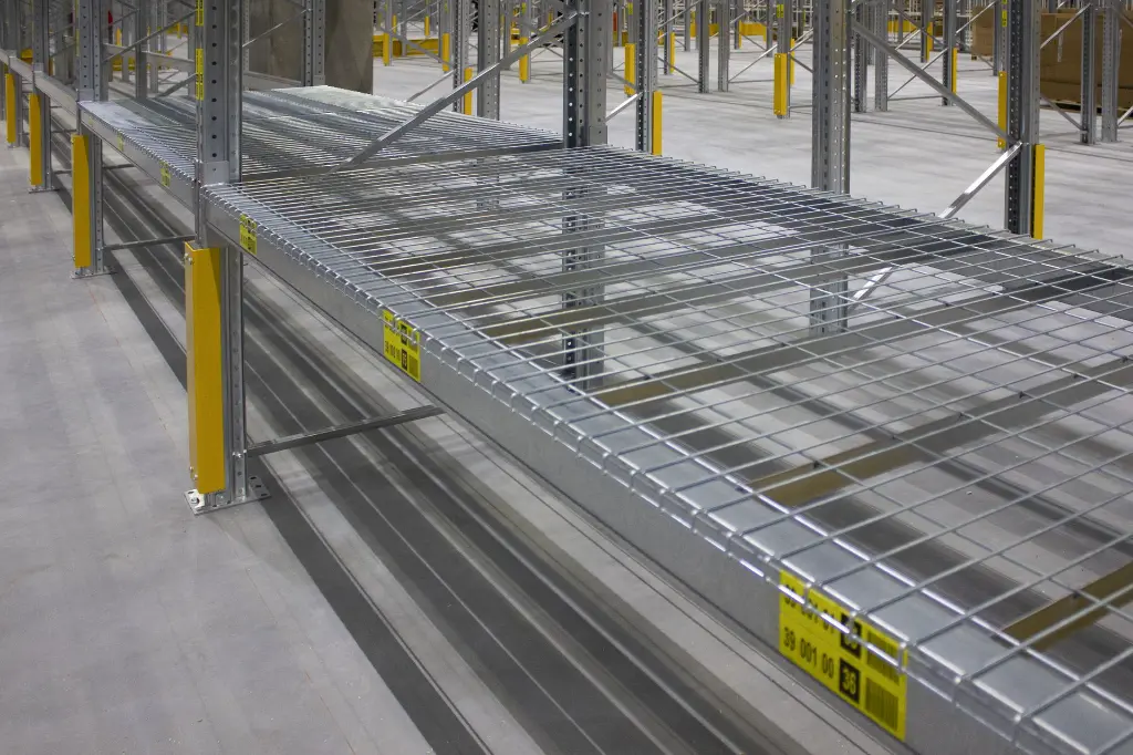 Wire mesh shelves on bx beams.webp